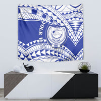 Blue and white Samoan-pattern tapestry with a central circular school emblem and swirls