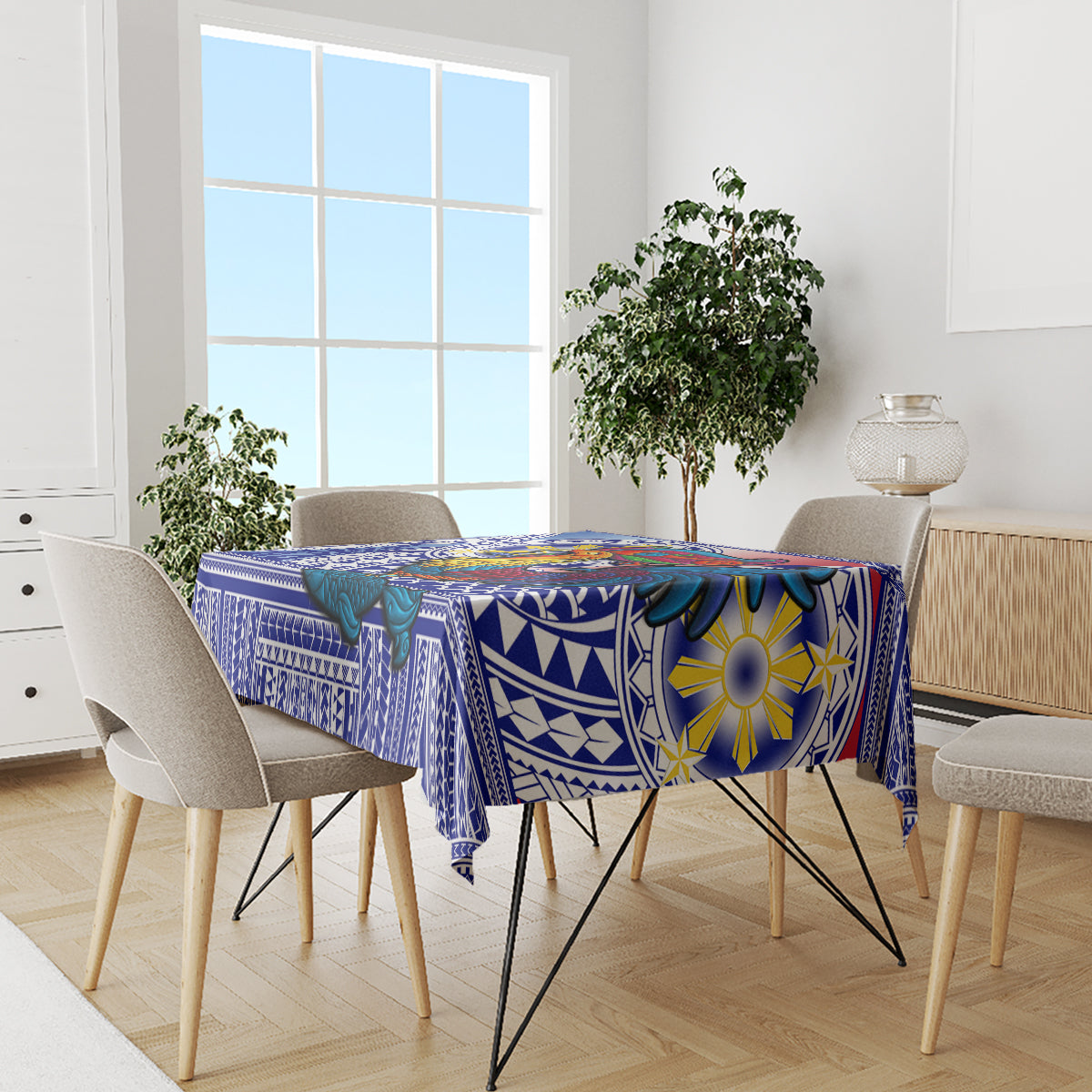 Blue personalized tablecloth on dining table with bold geometric and sun motif