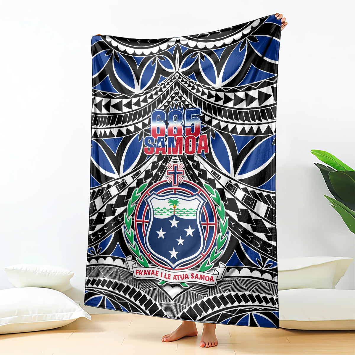 Blue, black tribal print blanket with central 685 Samoa crest and border designs