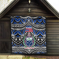 Rectangular Samoa 685 quilt displayed outdoors with bold blue patterns and central crest