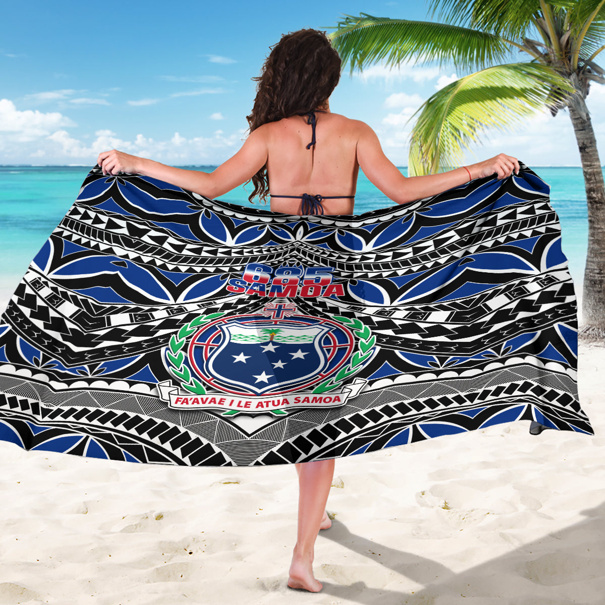 Samoa 685 sarong draped with blue, black, and white tribal design and crest