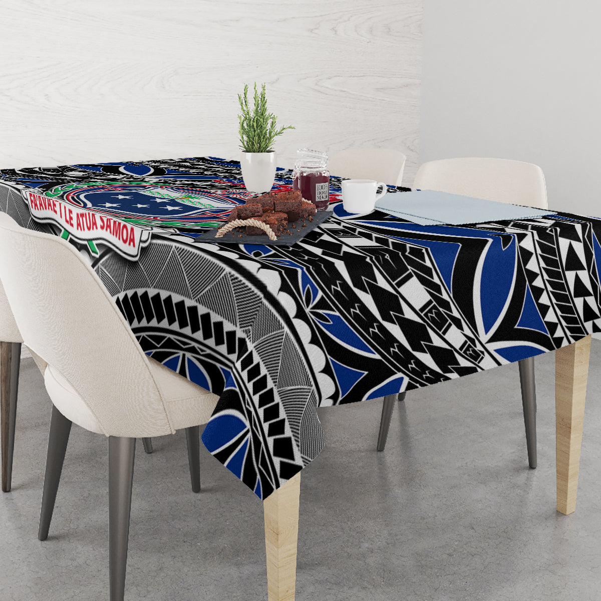 Blue and black tablecloth draped over table with Samoa emblem and tribal artwork