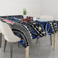 Blue and black tablecloth draped over table with Samoa emblem and tribal artwork