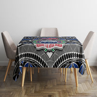 Blue tablecloth with center Samoa coat of arms and “FAVAVAE LE ATUA SAMOA” banner