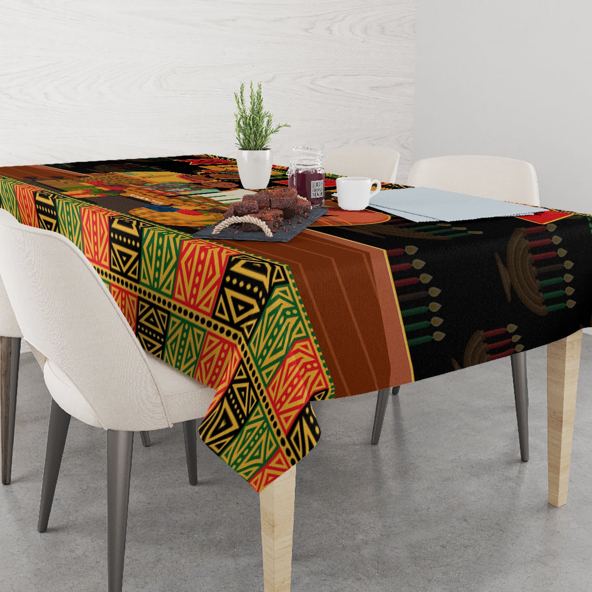 Black tablecloth with colorful African pattern covering tabletop and hanging corners