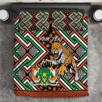 Personalized bedding set with bold geometric Ankara pattern and leopard print duvet