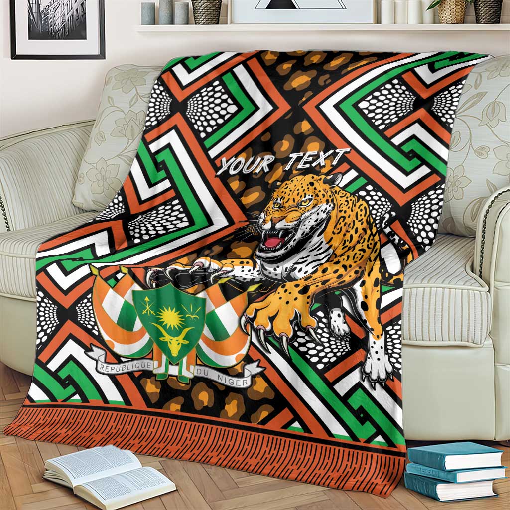 Personalized leopard and geometric Niger throw blanket with "YOUR TEXT" and orange striped edge
