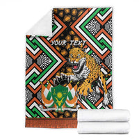 Folded personalized leopard and Niger-themed throw blanket with "YOUR TEXT" on black geometric pattern