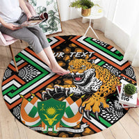 Personalized round rug with leopard face and bold green orange African geometric design