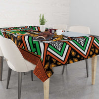Leopard motif tablecloth with bold green, orange, black, and white geometric shapes