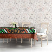 Dining tablecloth with leopard motif and multicolor African geometric border over a rectangular table