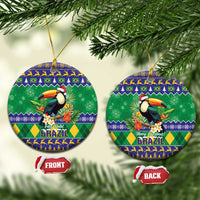 Round ceramic Christmas ornament with toucan and Brazil holiday pattern, hanging gold cord