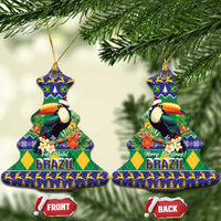Bell-shaped ceramic Christmas ornament with toucan and Brazil holiday text, gold hanging cord