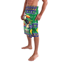 Green Christmas lavalava sarong, toucan graphic on blue-yellow border, side view