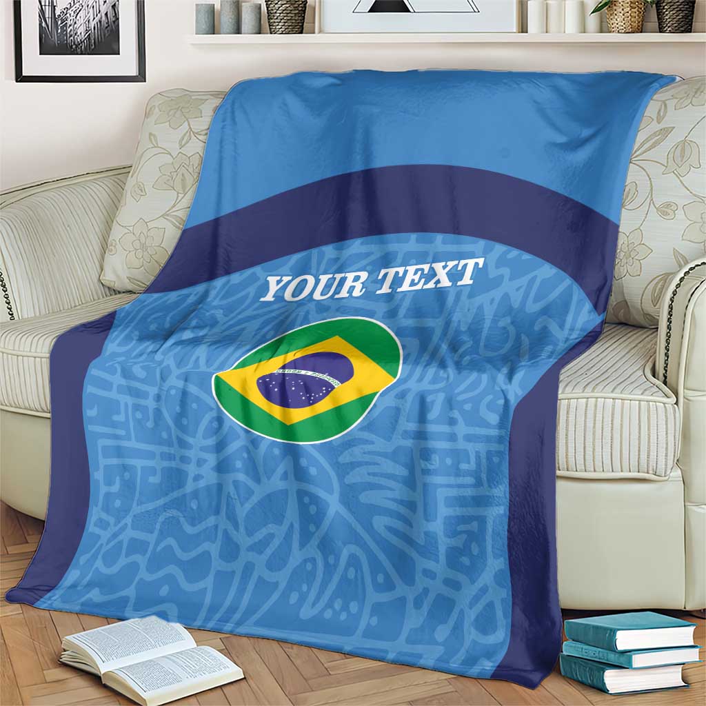 Blue football blanket draped on armchair, Brazil flag circle and custom text