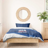 Blue and white bedding set with USA Rugby 7s text on the duvet and one pillow