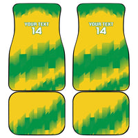 Four car floor mats, yellow-green geometric design with "YOUR TEXT 14" text.