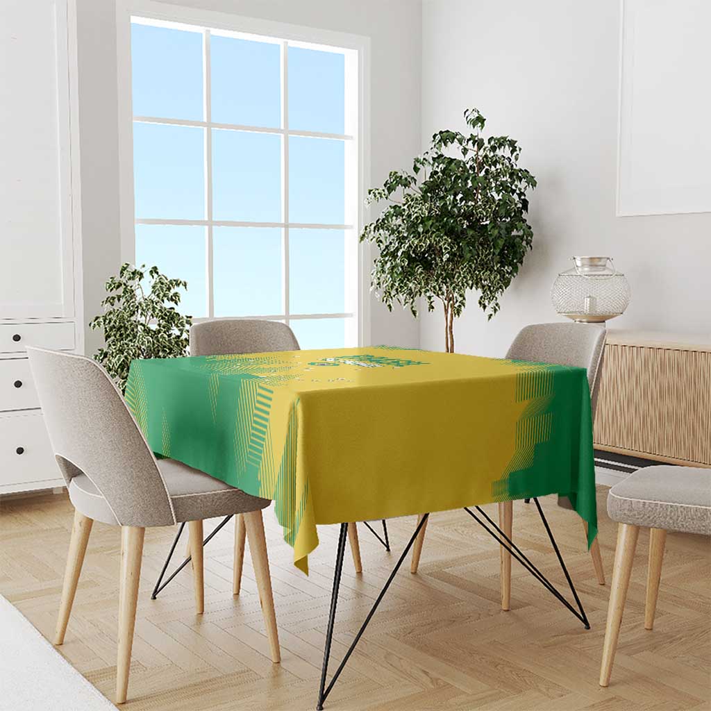 Yellow and green rugby tablecloth draped on dining table with chairs