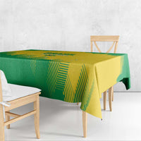 Geometric green and yellow rugby tablecloth over bench table with hanging edges