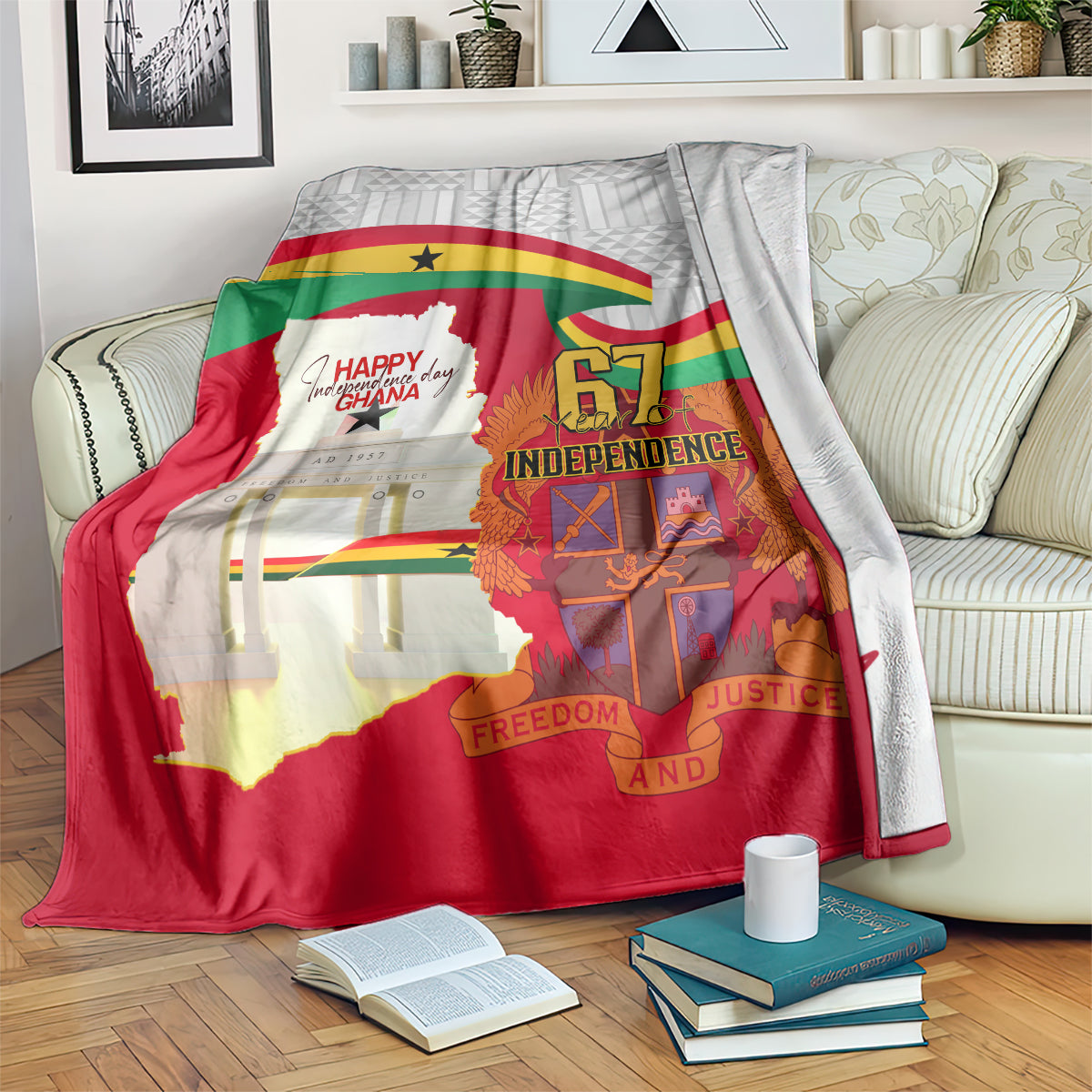 Red Ghana Independence blanket on sofa, showing Ghana flag, map, and “Freedom and Justice”