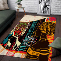 African pattern rug with teal stripe border and black, red, gold woman silhouettes
