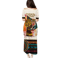 Women’s long dress back view, white with colorful African graphic print, short sleeves