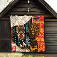 Women's African quilt blanket hanging outdoors with bold portraits, multicolor, quilted backing, Happy Women's Day.