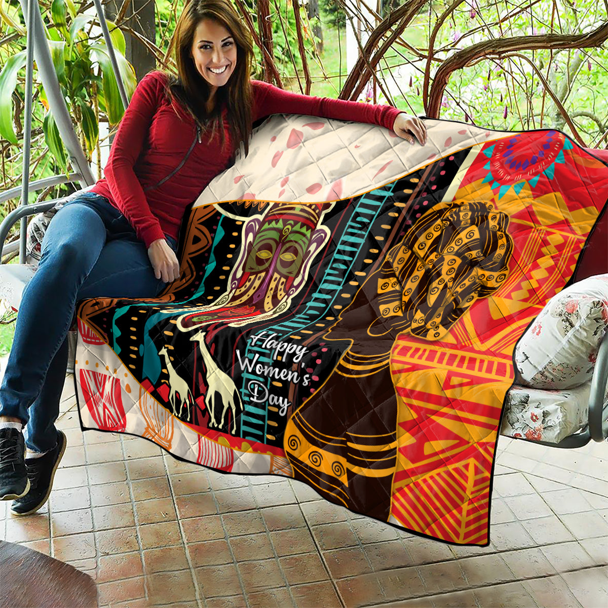 Women's African quilt blanket on patio with bold portraits, multicolor, quilted backing, Happy Women's Day.