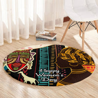 Round African-pattern carpet with central vertical motif and “Happy Women’s Day”