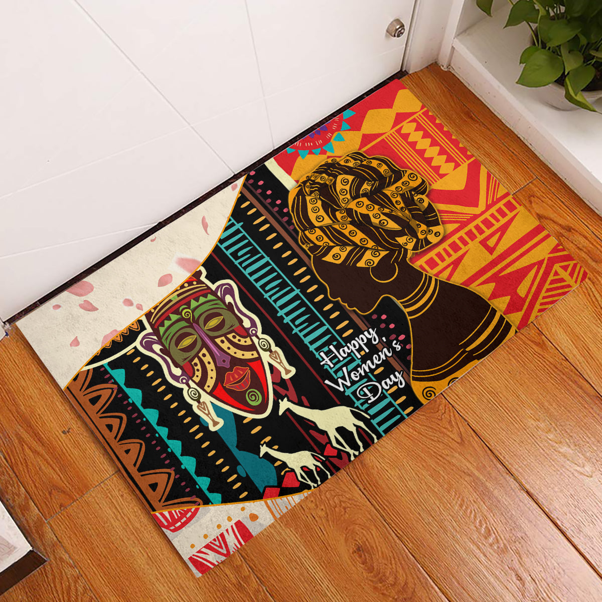 Rubber doormat with two African woman faces, geometric stripes, and Happy Women’s Day