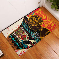 Rubber doormat with two African woman faces, geometric stripes, and Happy Women’s Day