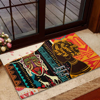Rubber doormat with bold African geometric border and twin women portraits