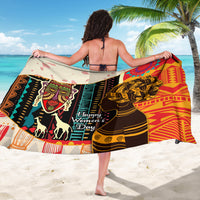 Women’s sarong with bold African faces, animals, and “Happy Women’s Day” lettering