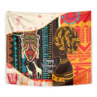 Close-up African wall tapestry showing woman profile, horse figures, and intricate red and gold patterns