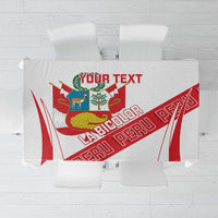 White tablecloth with red diagonal stripes and Peru-style crest center design