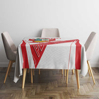 White tablecloth with red diagonal panels and crest motif across center