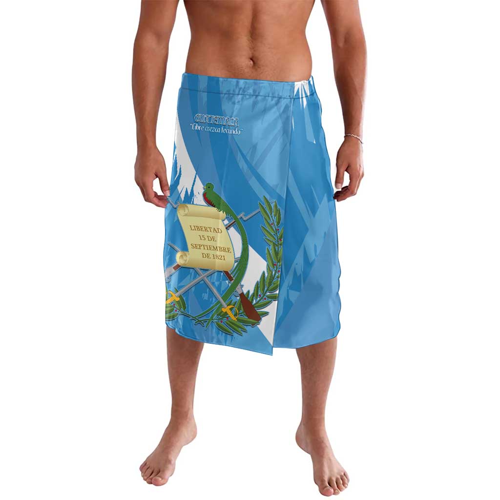 Blue swim shorts with elastic waistband and colorful emblem plus quetzal-style bird print
