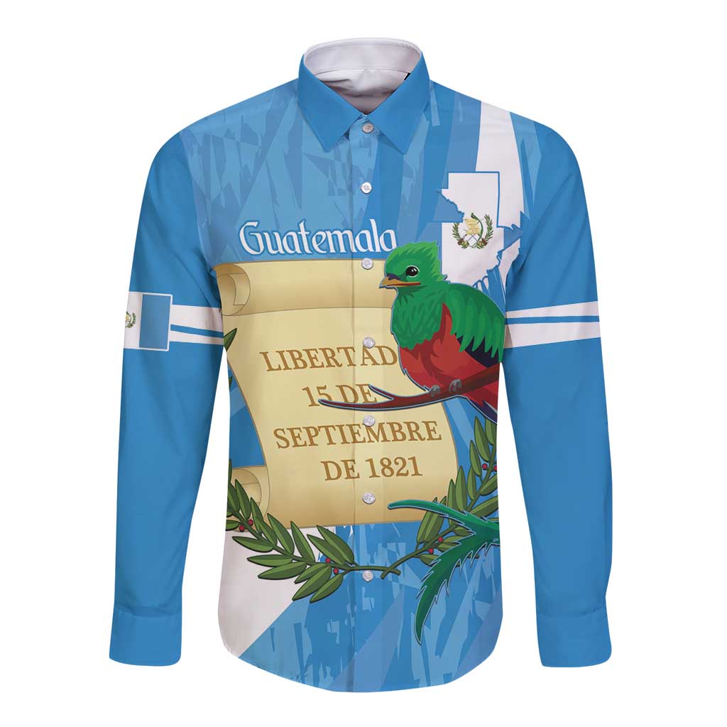 Blue long sleeve button shirt with front emblem and green quetzal bird graphic