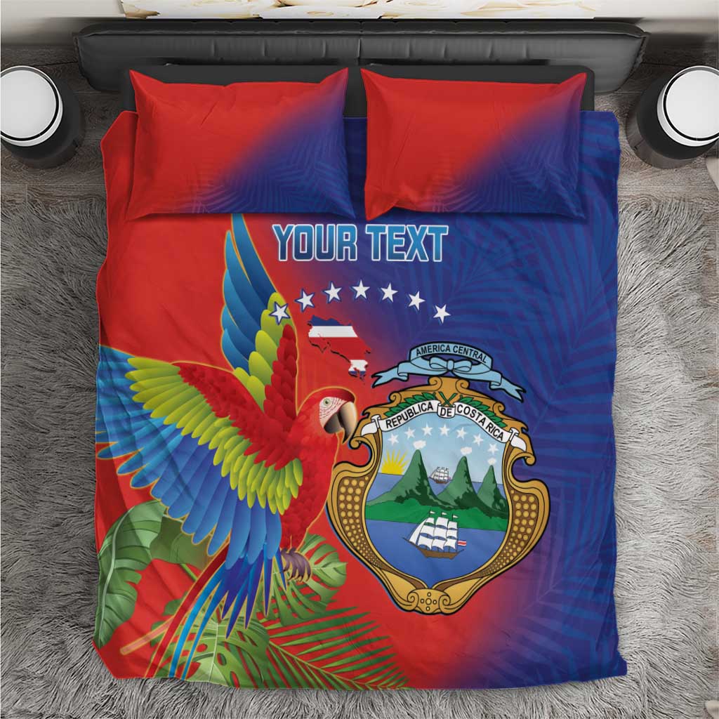 Personalized bedding set top view, red/blue duvet with macaw and coat of arms, 2 pillows