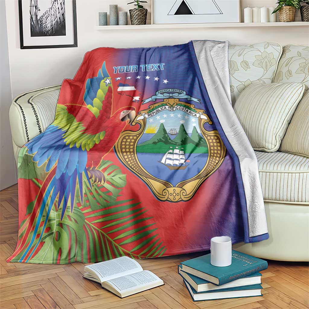 Draped personalized blanket with macaw and Costa Rica coat of arms, red blue.