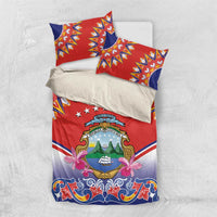 Red and blue Independence bedding set with crest emblem, floral accents, and “Your Text”.