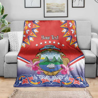 Personalized Costa Rica blanket on sofa, red center with 'Your Text', stars and crest