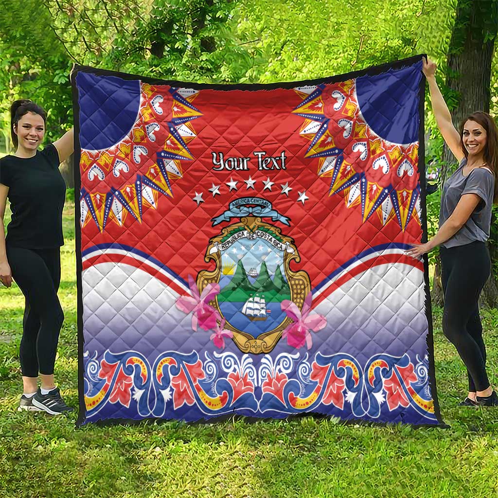 Personalized red quilt with navy corners, Costa Rica crest center, stars and blue wave edge