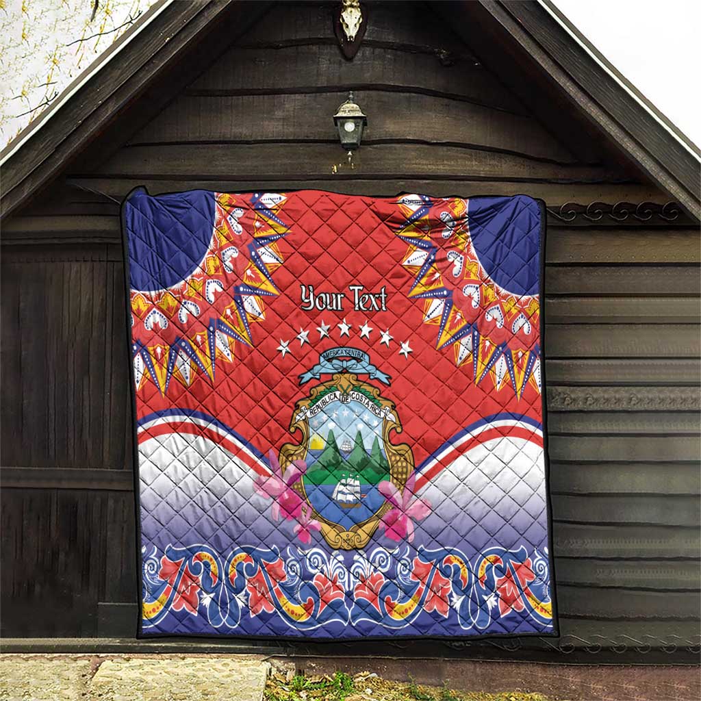 Personalized red quilt hanging on wooden door, Costa Rica crest and blue ornamental border