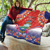 Personalized red quilt laid over couch, navy corner panels, Costa Rica crest and stars
