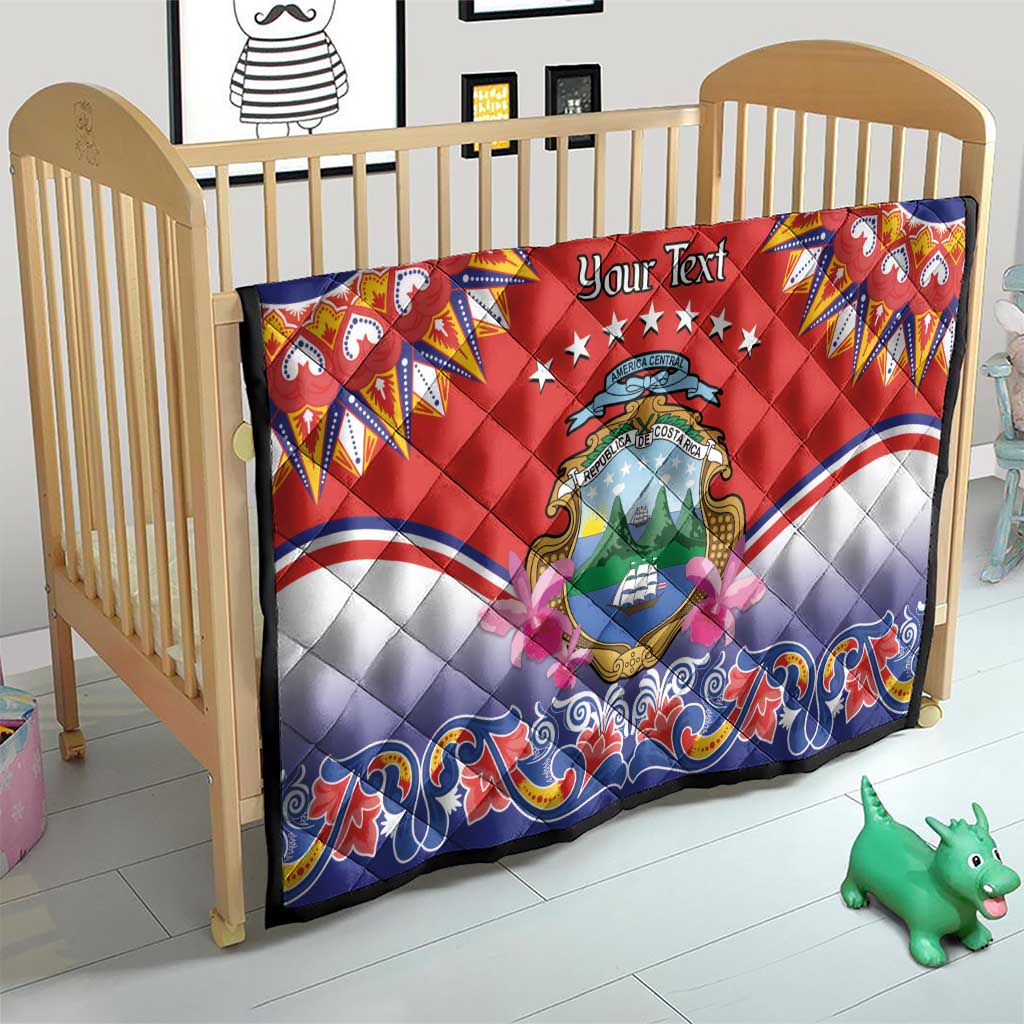 Personalized red quilt on toddler bed, Costa Rica crest center with blue wave border