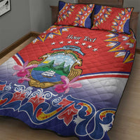 Red and blue personalized quilt bed set with 'Your Text', crest medallion, floral ribbon