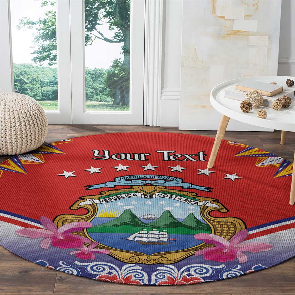 Round red rug with Costa Rica crest and “Your Text” across the center