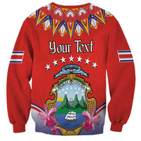Red crewneck sweatshirt with 'Your Text' folk crest and sleeve flag stripes