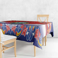 Blue, red, and white folk pattern tablecloth with decorative floral and scroll motifs